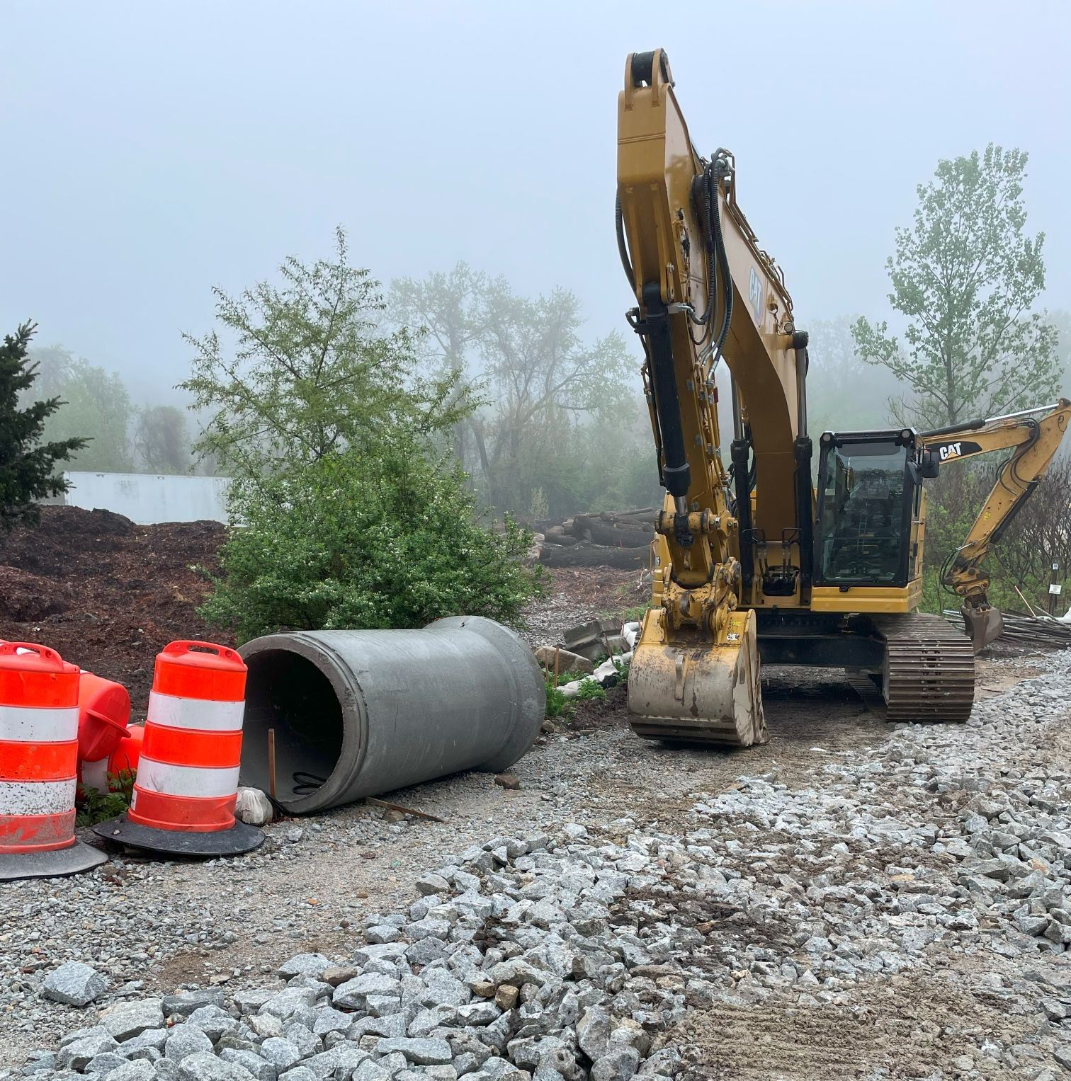 Image of Excavator and Drain Pipe